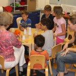 Firstday class: Laura teaching how to make a noisemaker.