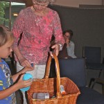 Distributing the noisemakers after meeting.